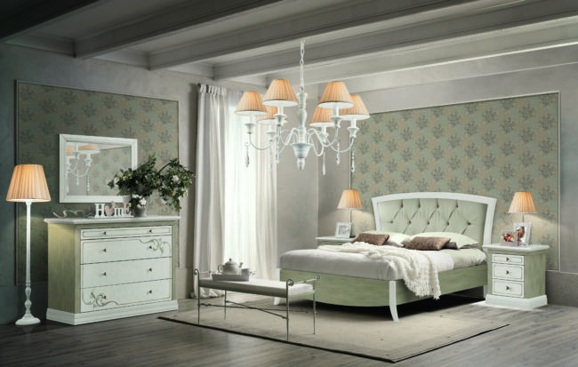 Double bed in light wood with padded headboard